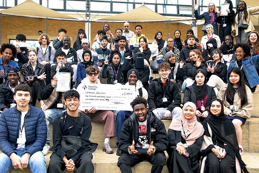 ESOL students at New City College Hackney campus with the charity cheque after fundraising through the Headstart project Ao C