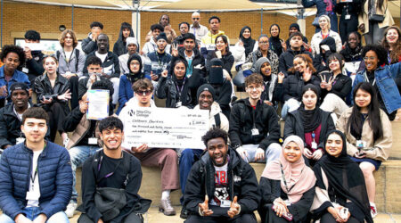ESOL students at New City College Hackney campus with the charity cheque after fundraising through the Headstart project Ao C